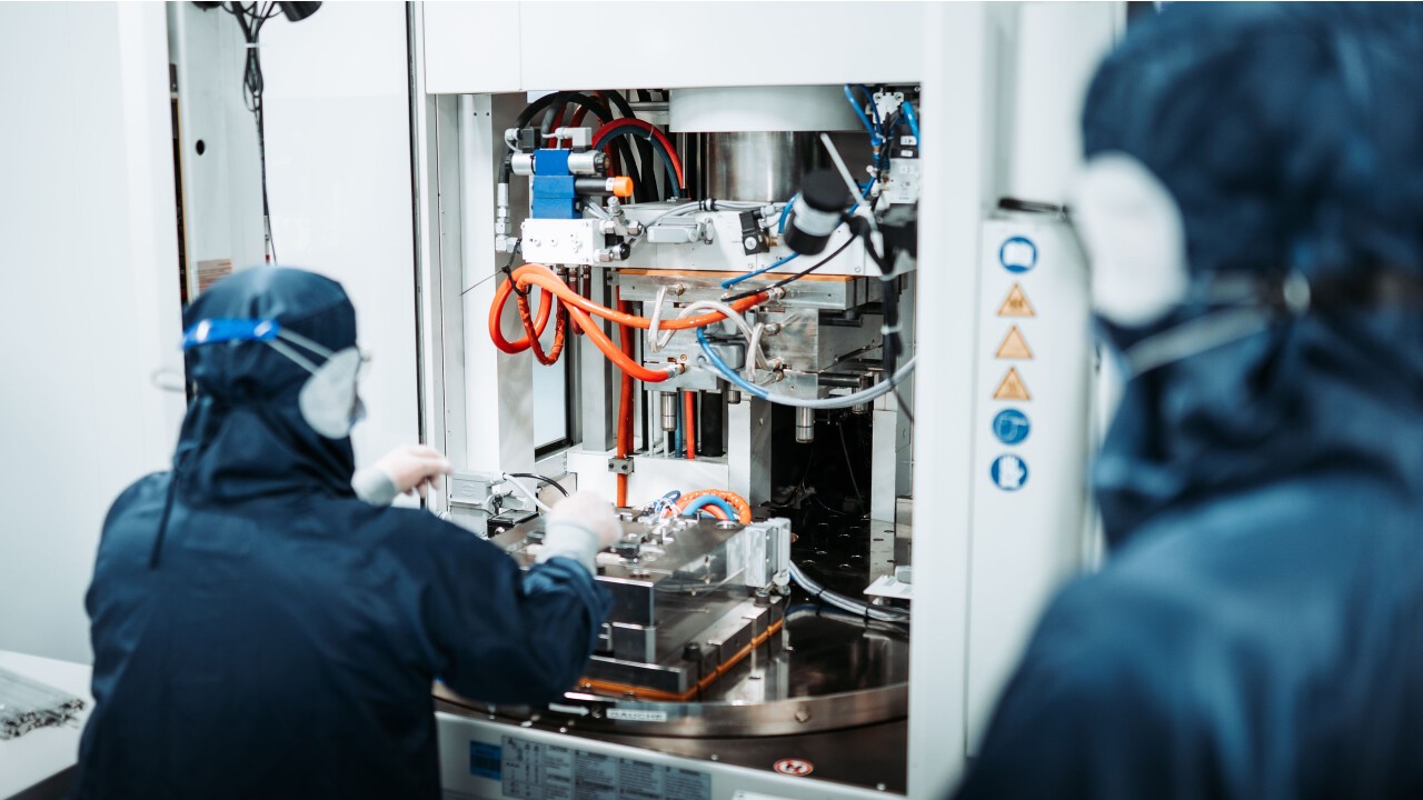 Cleanroom technician in the process of making single use medical devices