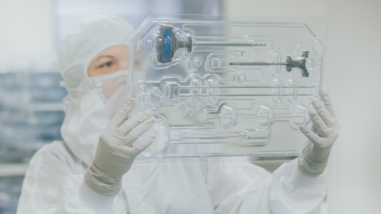 Cleanroom technician examing pre-assembled Procedure Kit