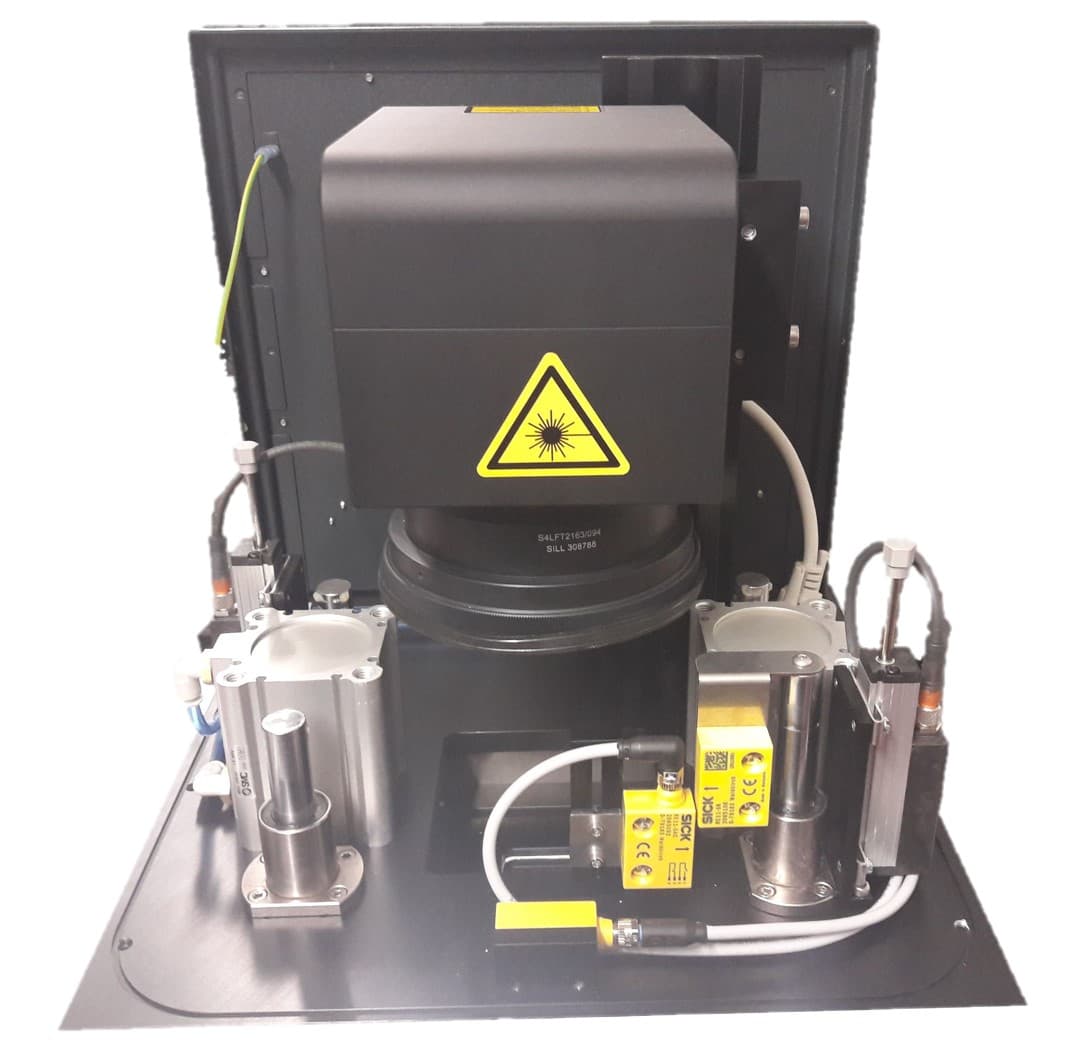 Interior of Modula Assembly Inline process cell with scanner optics and path sensors for collapse.